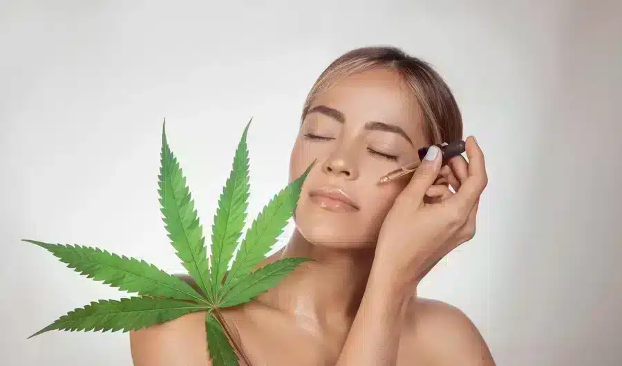 a girl use cbd oil as cbd benefits for her skin